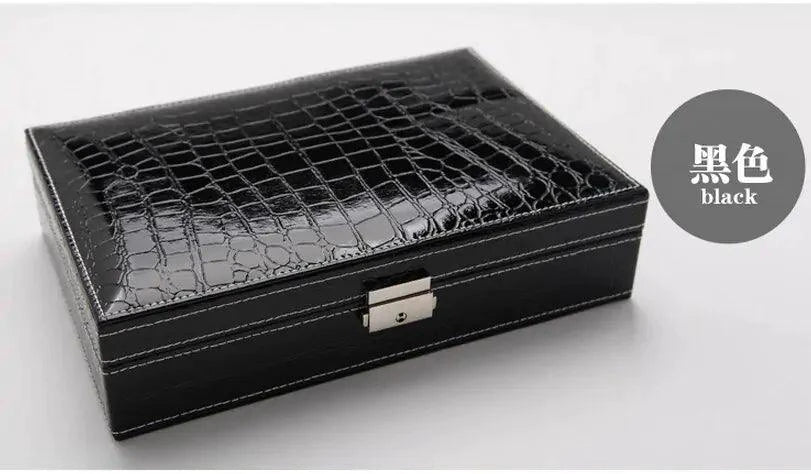Elegant leather vanity case by MANDOTOS featuring a sleek design with a handle and secure clasp, perfect for travel and beauty essentials.