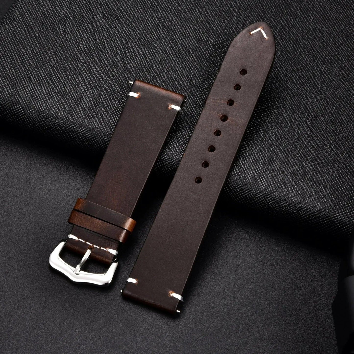 Mandotos elegant leather watch band with smooth brown leather strap and stainless steel buckle, designed for classic wristwatches.