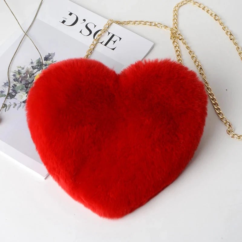 Mandotos women's heart-shaped faux fur crossbody handbag with plush soft chain strap and tote style for casual or evening wear.