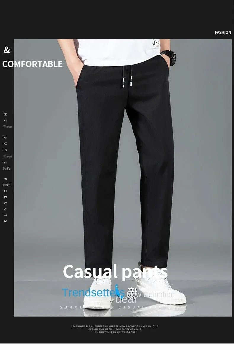 Mandotos Ice Silk men's summer casual pants in black and gray, breathable, elastic, straight-leg design for outdoor and business wear.