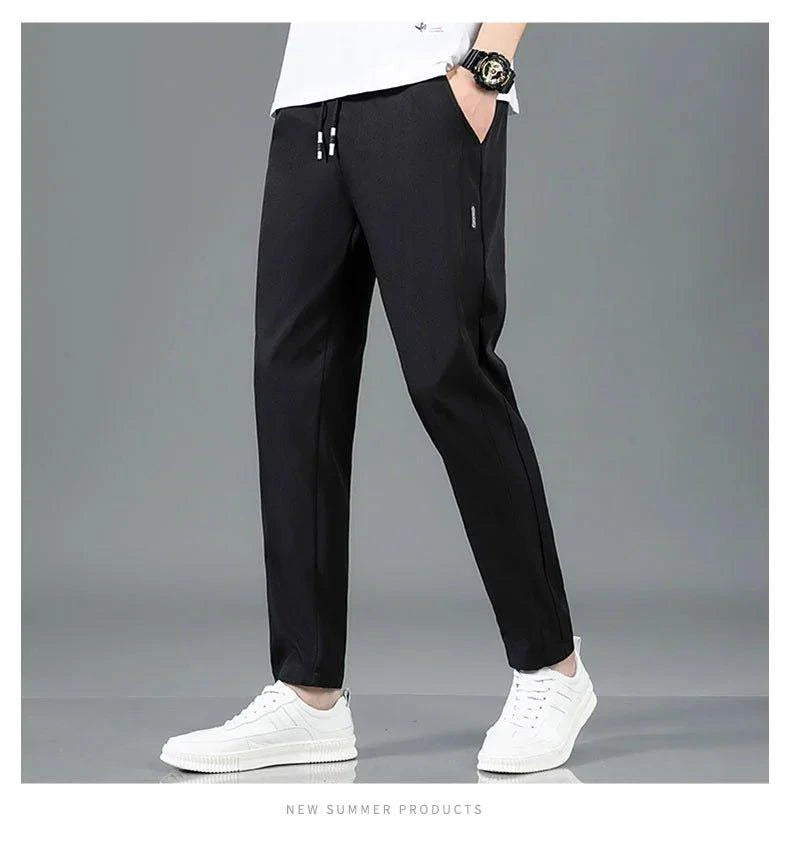 Mandotos Ice Silk men's summer casual pants in black and gray, featuring a straight-leg, elastic waistband, breathable and lightweight fabric.