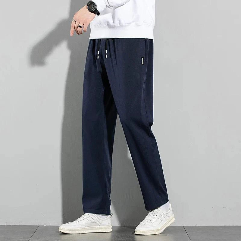 Mandotos Ice Silk men's summer casual pants in black and gray with elastic waistband, breathable straight-leg design, suitable for outdoor wear.