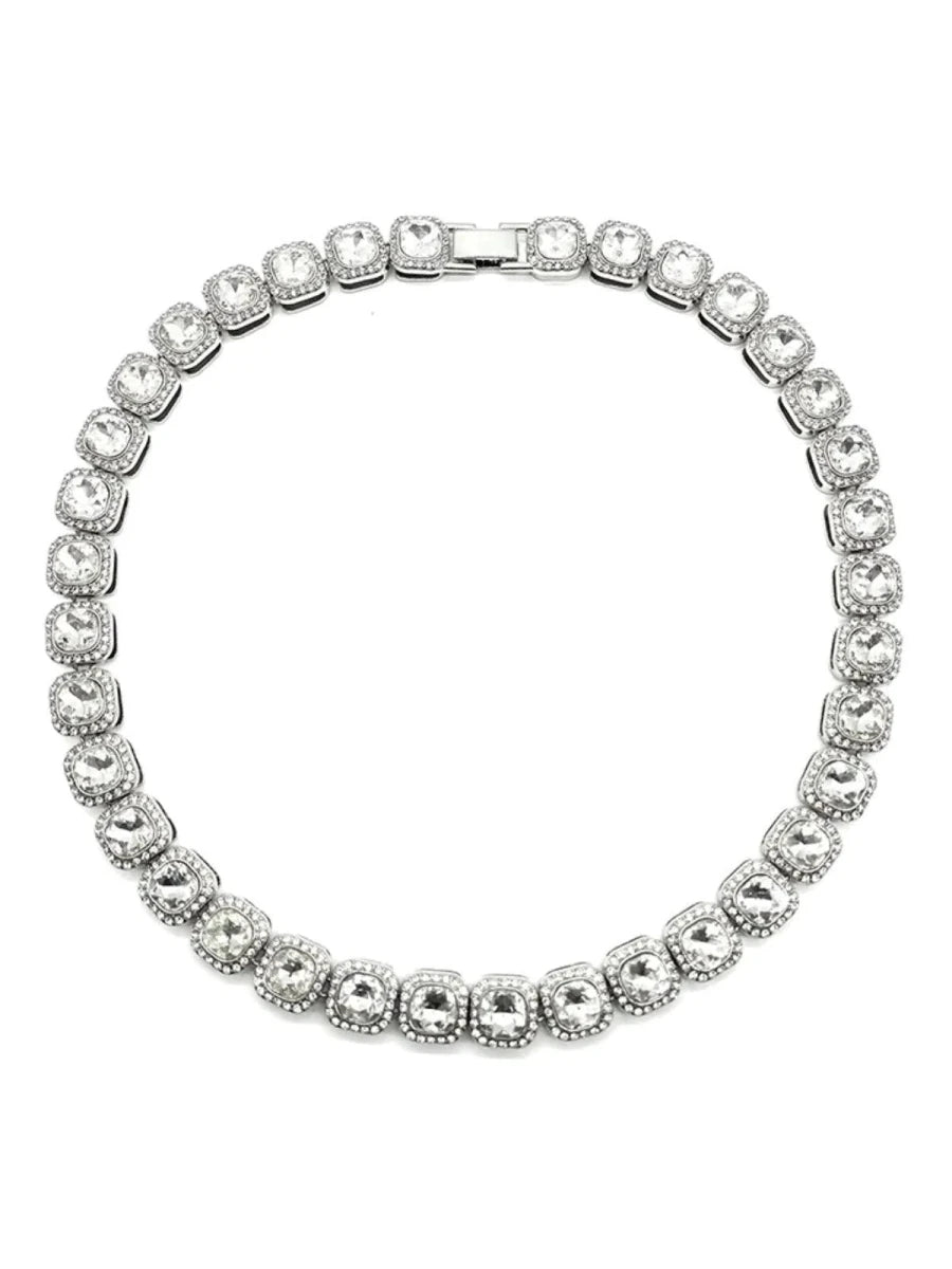 Mandotos Illumina tennis chain with clustered stones and radiant embellishments, showcasing elegant jewelry design and sparkling details.