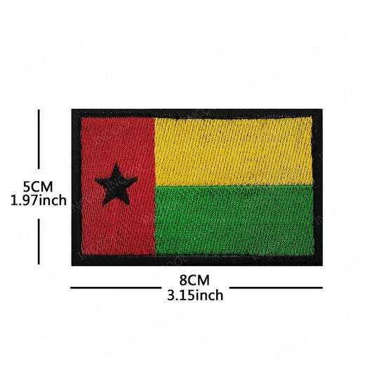Embroidery patches featuring African flags and badges from Morocco, Nigeria, Gabon, Libya, and Namibia by MANDOTOS INTERNATIONAL.