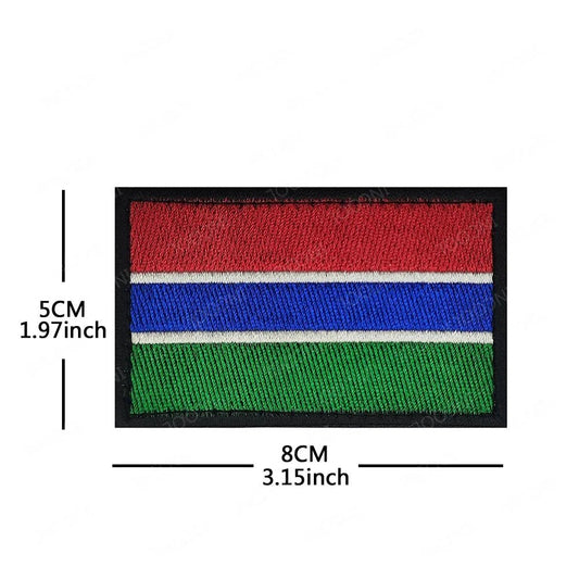 Embroidery patches of African flags and badges featuring Morocco, Nigeria, Gabon, Libya, and Namibia by MANDOTOS INTERNATIONAL.