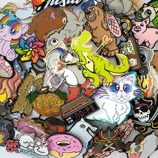 Assorted collectible mystery pins from MANDOTOS INTERNATIONAL in a bargain pin bag, featuring various unique designs.