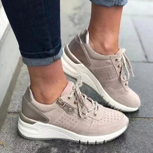 Fashionable lace-up sneakers with zipper detail and medium heel height by MANDOTOS INTERNATIONAL.
