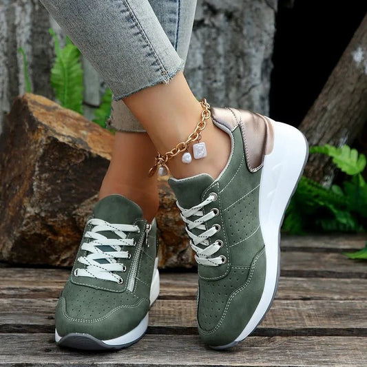 Fashionable lace-up sneakers with zipper detail and medium heel height by MANDOTOS INTERNATIONAL, showcasing stylish design and comfort.