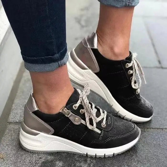 Fashionable lace-up sneakers with zipper detail and medium heel height from MANDOTOS INTERNATIONAL, showcasing stylish casual footwear.