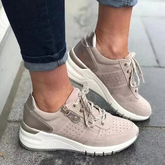 Fashionable lace-up sneakers with zipper detail and medium heel height by MANDOTOS INTERNATIONAL, shown from a side view.