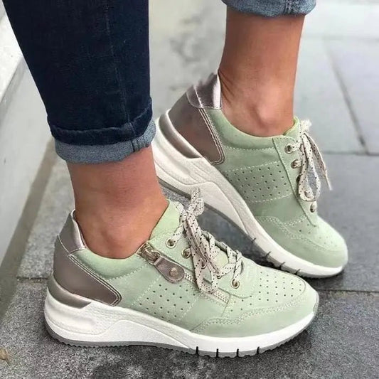 Fashionable lace-up sneakers with zipper detail and medium heel height from MANDOTOS INTERNATIONAL, showcasing stylish design and comfort.