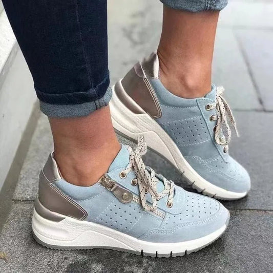 Mandotos International fashionable lace-up sneakers with zipper detail and medium heel height, stylish and comfortable footwear for women.