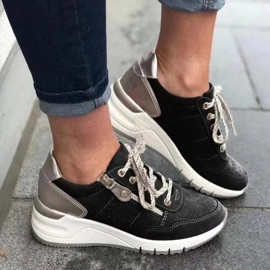 Fashionable lace-up sneakers with zipper detail and medium heel height by MANDOTOS INTERNATIONAL, shown in stylish side view.