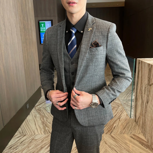 British Korean style plaid men's 3-piece business casual suit set by MANDOTOS INTERNATIONAL, featuring tailored jacket, vest, and trousers.