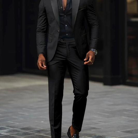 Men's slim-fit business casual suit jacket and trousers by MANDOTOS INTERNATIONAL, tailored for a modern, professional look.