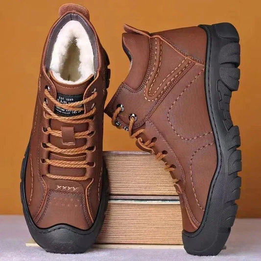 Men's waterproof winter ankle boots by Mandotos International with non-slip soles, ideal for work and cold weather conditions.