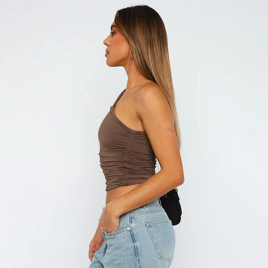 Mandotos International one-shoulder backless tank top in candy color, sleeveless casual t-shirt displayed on a model.