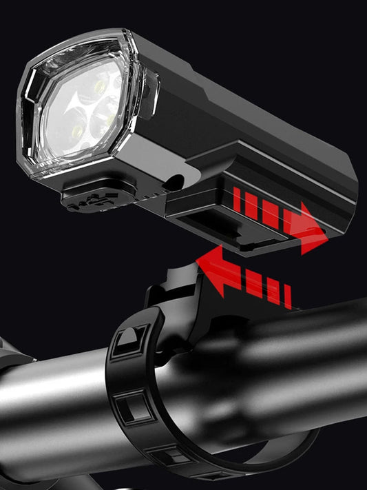 Mandotos International super bright LED bicycle front light mounted on handlebars for night riding visibility.