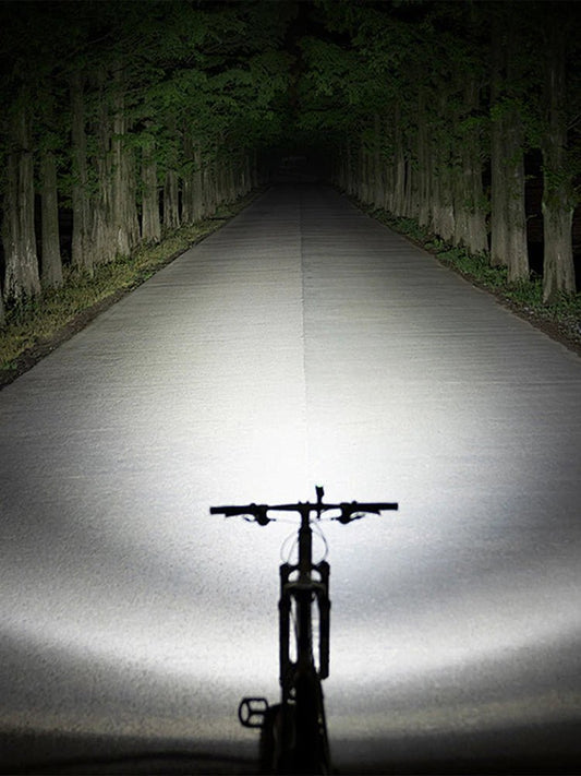 Mandotos International super bright LED bicycle front light mounted on a bike for night riding visibility and safety