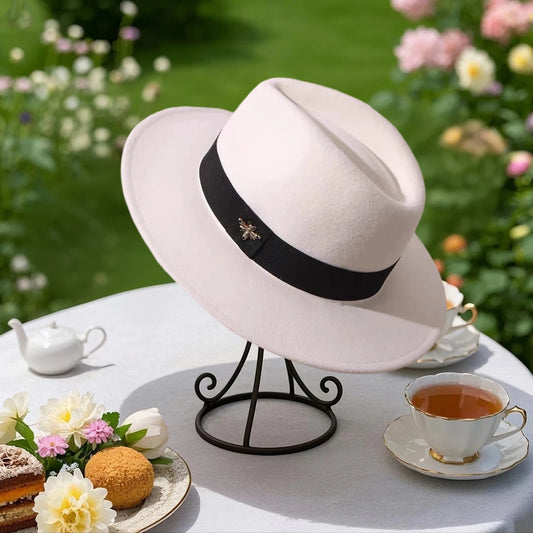 Vintage wool fedora hat with feather band by MANDOTOS INTERNATIONAL, ideal for formal events and weddings.