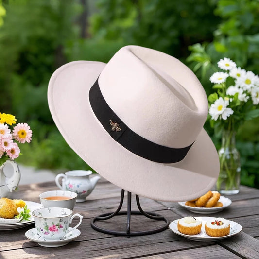 Vintage wool fedora with feather band by MANDOTOS INTERNATIONAL, ideal for formal events and weddings.