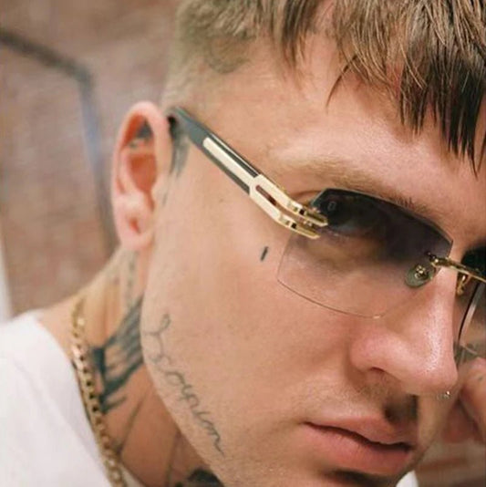 Vintage rimless sunglasses with stylish PC frames by MANDOTOS INTERNATIONAL, featuring sleek, lightweight design and modern appeal.