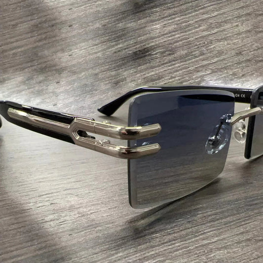 Vintage rimless sunglasses with stylish PC frames by Mandotos International, showcasing sleek and modern eyewear design.
