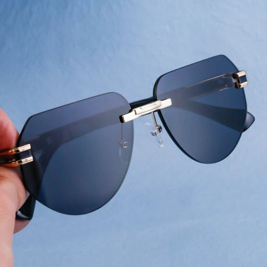 Vintage rimless sunglasses by MANDOTOS INTERNATIONAL, stylish unisex outdoor eyewear with sleek design and UV protection.