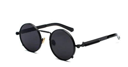 Vintage steampunk circular shades by MANDOTOS INTERNATIONAL featuring metal frames and tinted lenses for a retro look.