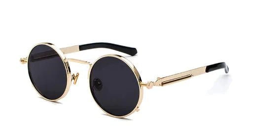 Vintage steampunk circular shades by MANDOTOS INTERNATIONAL featuring round metal frames and tinted lenses for retro style.