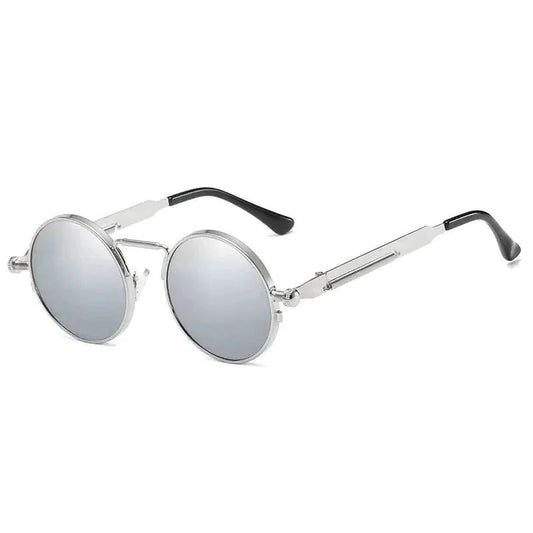Vintage steampunk circular sunglasses by MANDOTOS INTERNATIONAL with metal frames and tinted lenses.