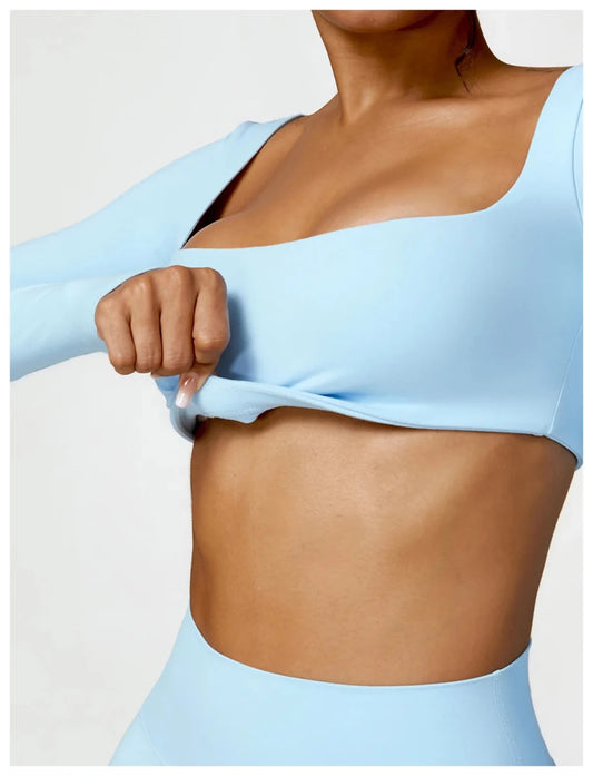 Women's long sleeve fitness T-shirt by MANDOTOS INTERNATIONAL, designed for gym workouts and push-up support.