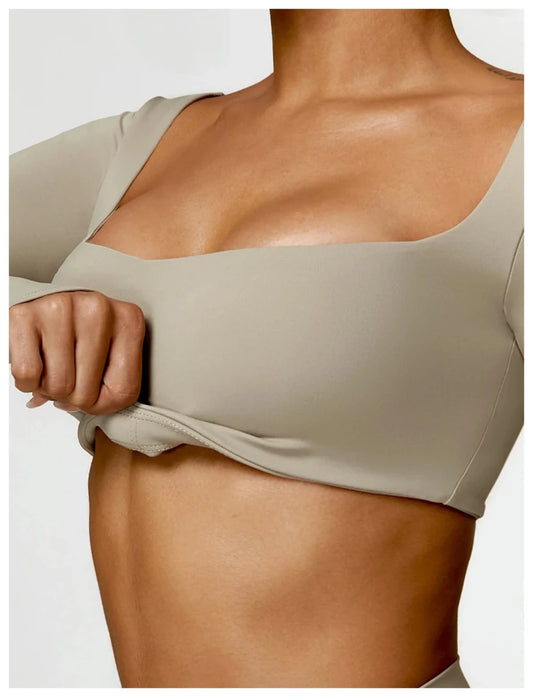 Women's long sleeve fitness T-shirt by MANDOTOS INTERNATIONAL, gym push-up top, made for active workouts and comfortable fit.
