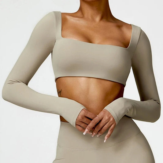 Mandotos International women's long sleeve fitness T-shirt with push-up design, ideal for gym and workout sessions.