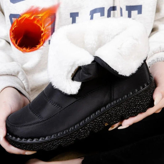 Women's waterproof winter snow boots by MANDOTOS INTERNATIONAL featuring non-slip soles, ankle height, and warm platform design.