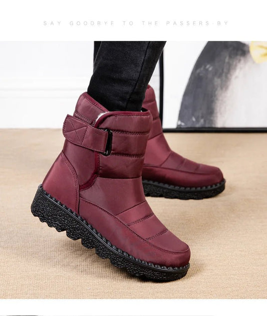 Women's waterproof winter snow boots by MANDOTOS INTERNATIONAL with non-slip soles, ankle height, warm platform design, and stylish look.