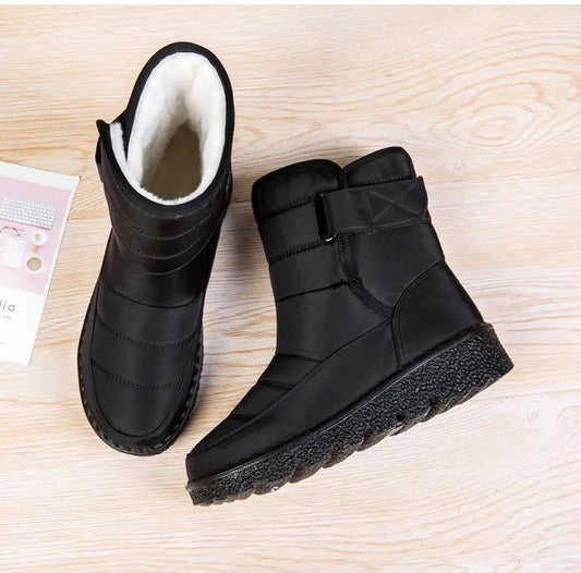 Women's waterproof winter snow boots by MANDOTOS INTERNATIONAL with non-slip soles, warm lining, and platform design.