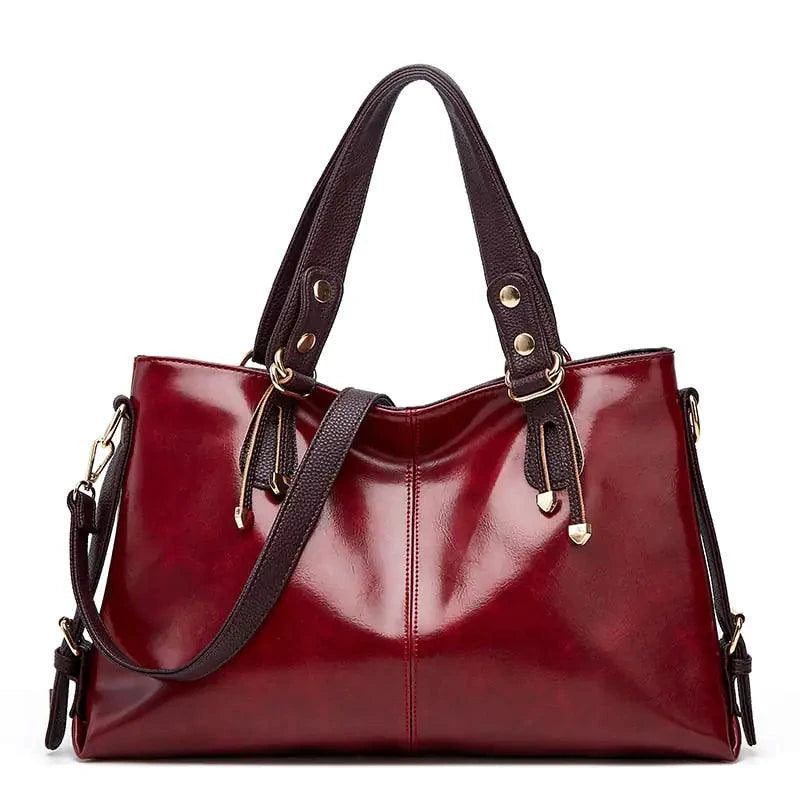 Mandotos Kathie leather tote purse with spacious interior, sturdy handles, and sleek design in rich brown leather.
