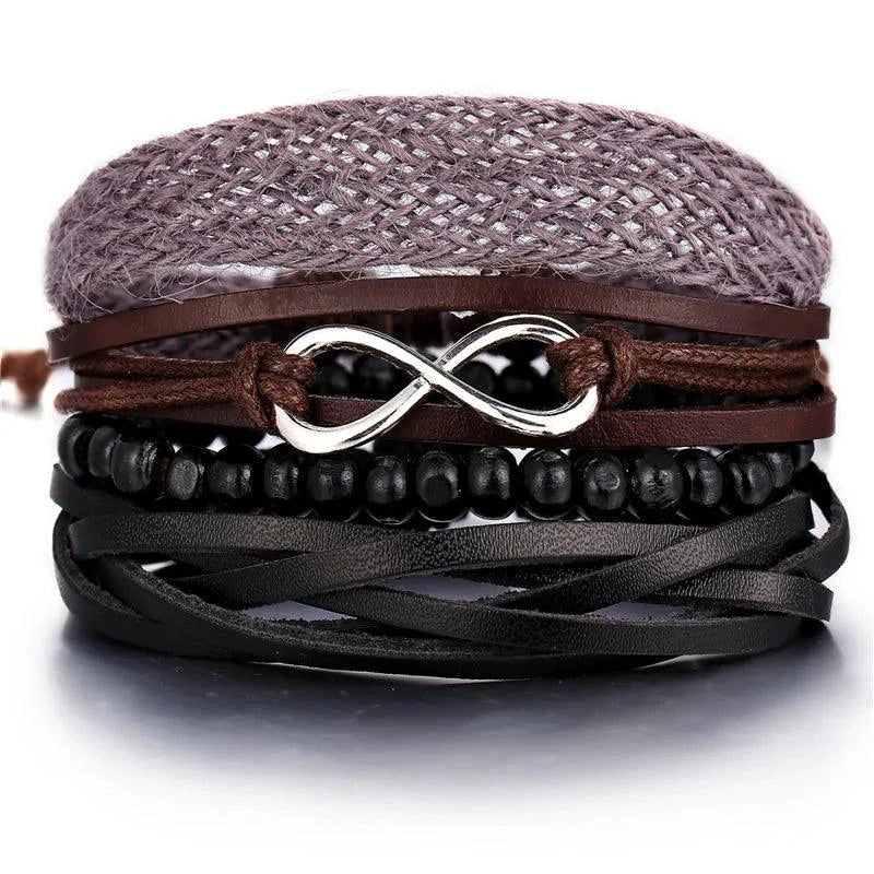 Layered leather charm bracelet by MANDOTOS featuring multiple leather bands and decorative metal charms.