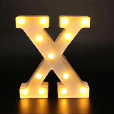 Mandotos luminous letter lights spelling out a word, illuminated with warm glow, ideal for decorative lighting in a room.