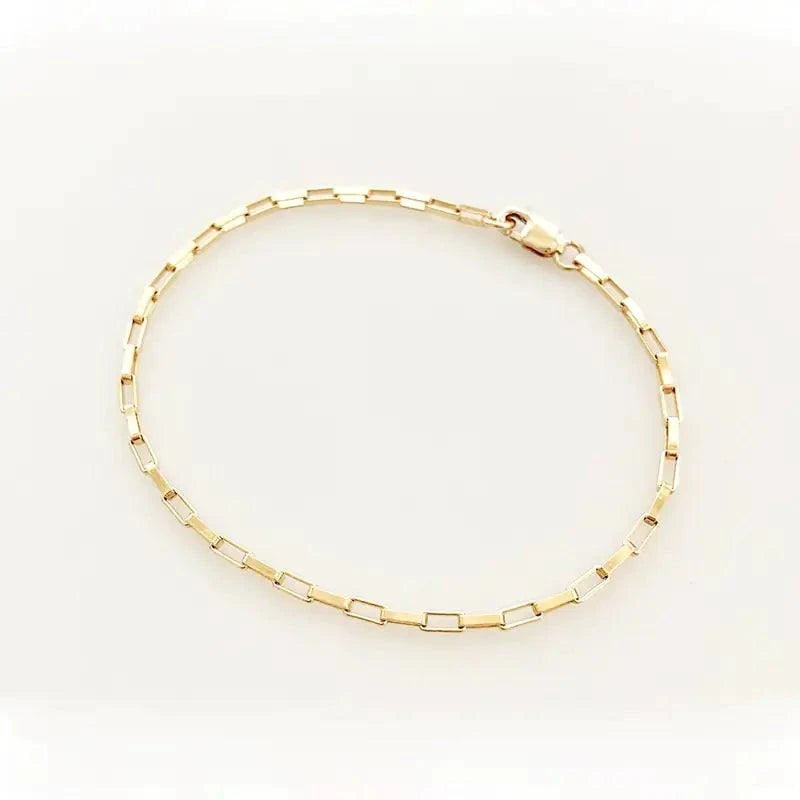 Handcrafted luxury gold chain bracelet by MANDOTOS with intricate links and polished finish, stylish and elegant jewelry accessory.