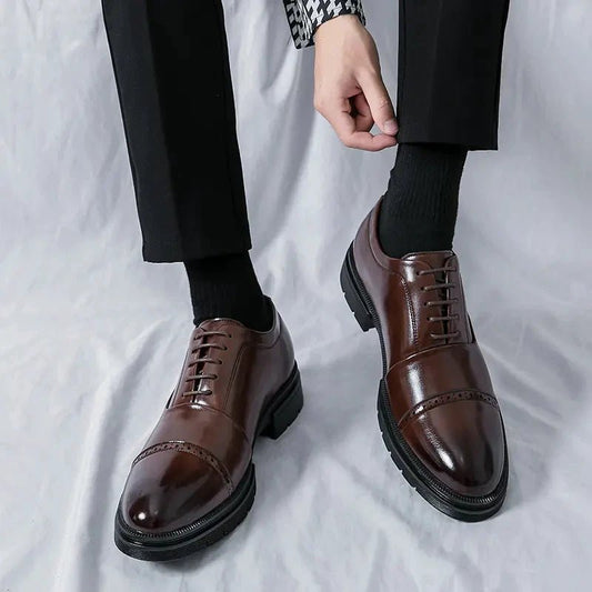Men's elegant breathable tassel loafers by MANDOTOS, showcasing sleek leather design with tassel details and comfortable fit.