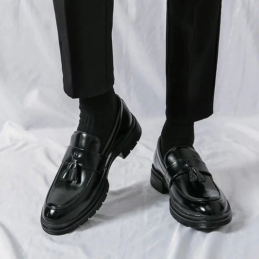 Men's elegant breathable tassel loafers by MANDOTOS, featuring sleek design and comfortable leather material.