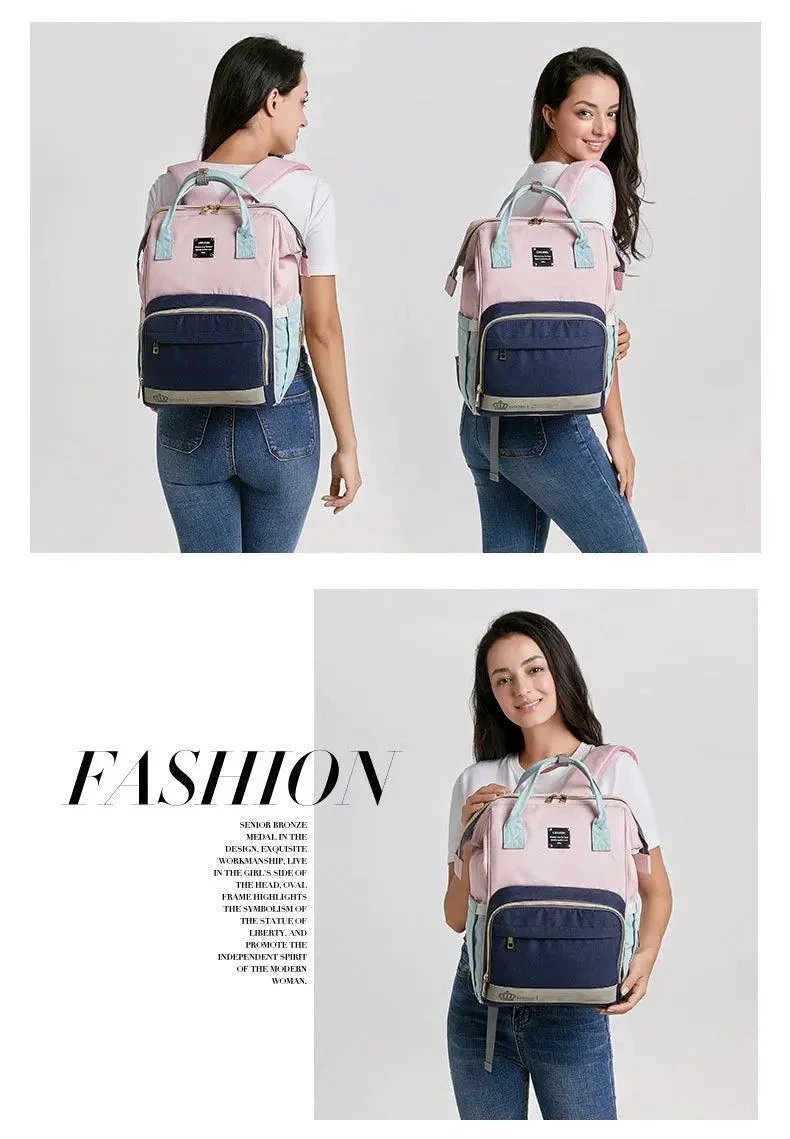 Mandotos Mummy Maternity Bag with multiple compartments and handles, designed for moms to carry baby essentials comfortably.