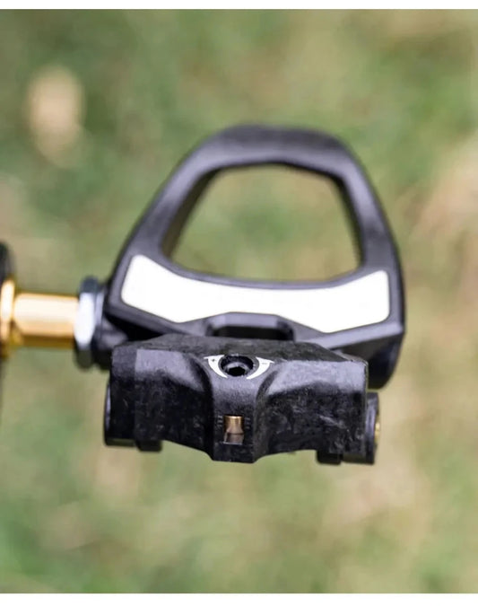 Mandotos ONIRII PD-06 Carbon Lock Pedals for cycling, showing sleek black design and secure locking mechanism.