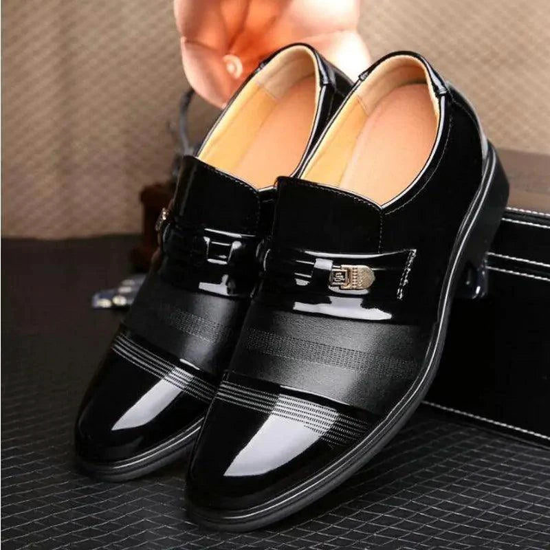 Pair of black patent leather shoes by MANDOTOS, featuring a sleek design with shiny finish and classic style.