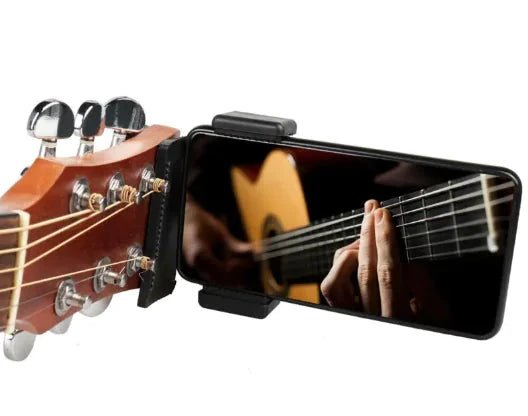 Mandotos Phone Guitar Clip Stand holding a smartphone, compact and adjustable for convenient hands-free use.