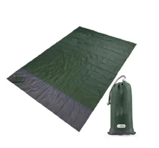Mandotos sandproof portable beach mat spread on sandy shore, lightweight and foldable for easy beach outings.