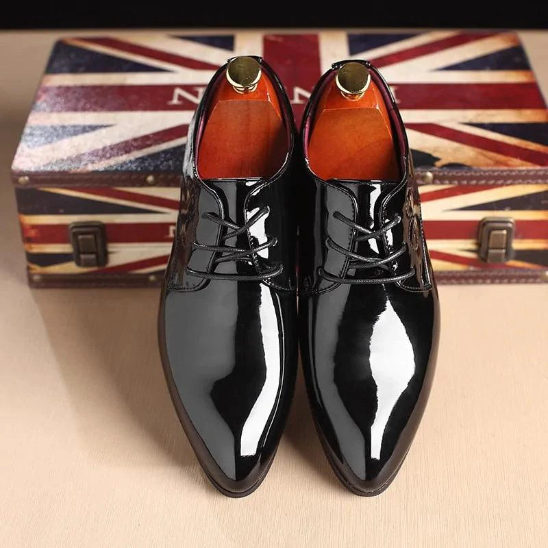 Mandotos sleek leather Oxford shoes with polished finish, featuring classic lace-up design and elegant black leather material.