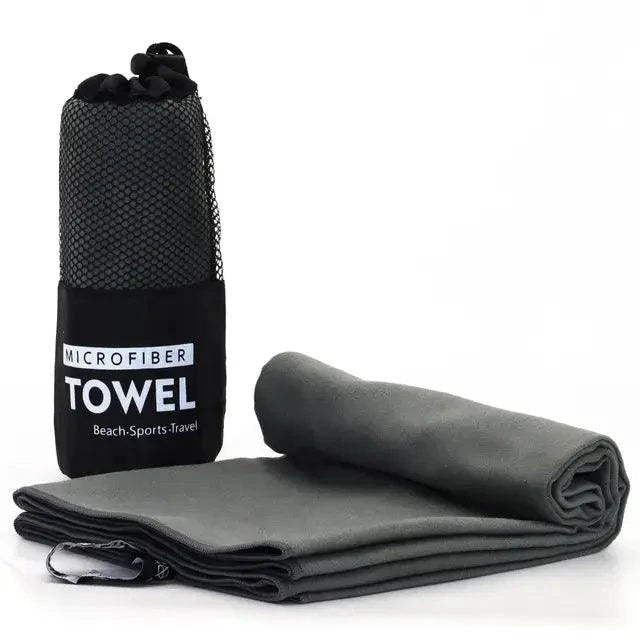 MANDOTOS Speedy Absorb Microfiber Towel spread out, showing its lightweight, quick-drying fabric ideal for travel and outdoor use.
